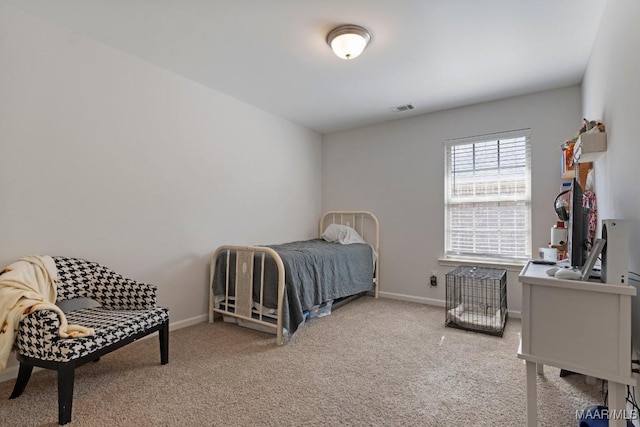 carpeted bedroom with visible vents and baseboards