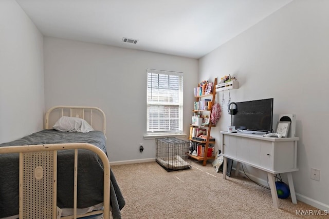 bedroom featuring carpet floors, visible vents, and baseboards