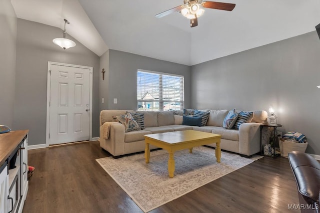 living room with dark wood-type flooring, vaulted ceiling, baseboards, and a ceiling fan