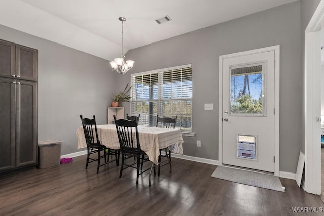 dining room with dark wood-style floors, plenty of natural light, visible vents, and a notable chandelier