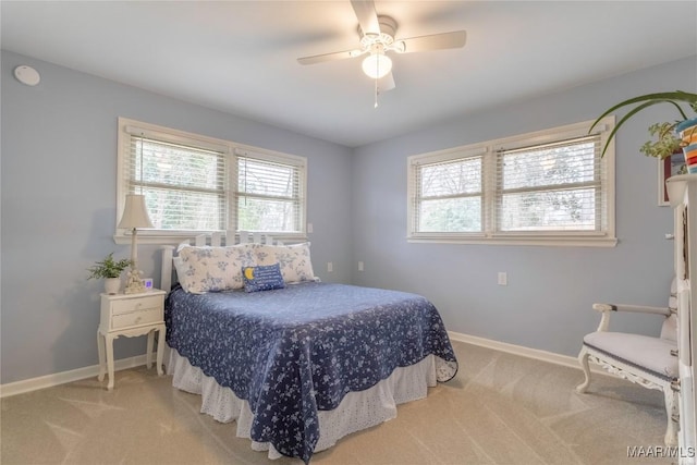 bedroom with carpet, a ceiling fan, and baseboards