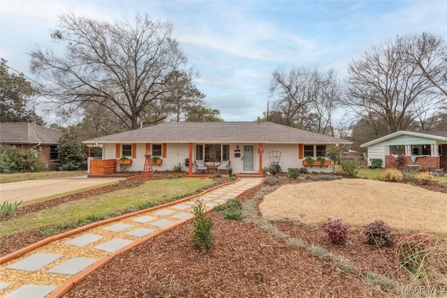 single story home featuring covered porch