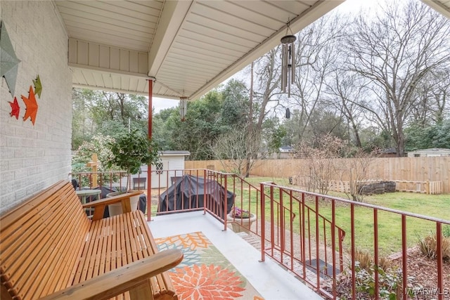 view of patio featuring a fenced backyard and an outbuilding