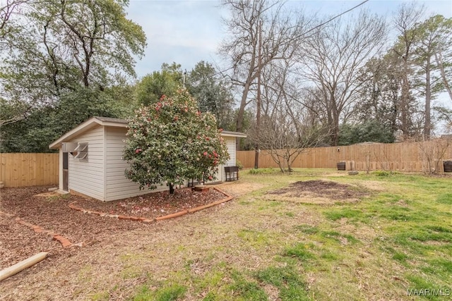 view of yard with an outbuilding and a fenced backyard