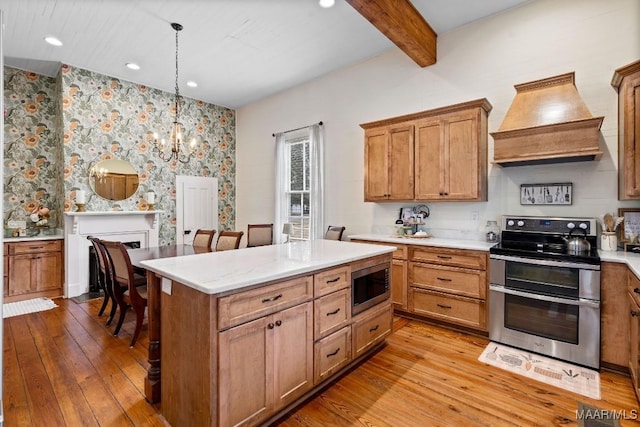 kitchen featuring stainless steel appliances, custom range hood, beamed ceiling, and hardwood / wood-style flooring