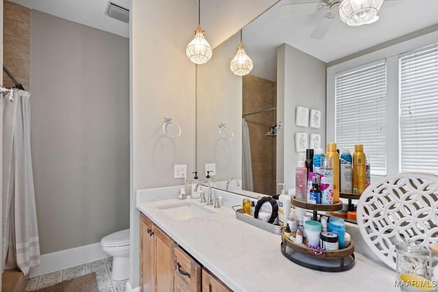 bathroom with toilet, tile patterned floors, vanity, and a shower with curtain