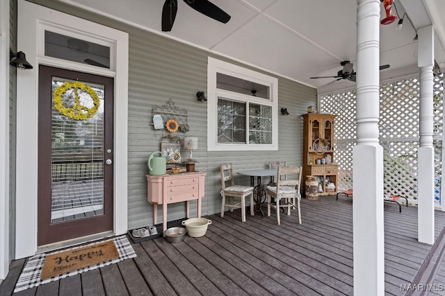 wooden terrace with a ceiling fan