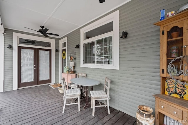 deck featuring a ceiling fan and french doors