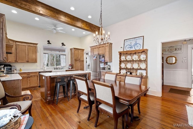 dining area featuring a ceiling fan, recessed lighting, beamed ceiling, and hardwood / wood-style floors