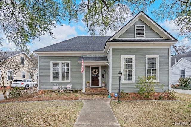 view of front of home featuring a shingled roof