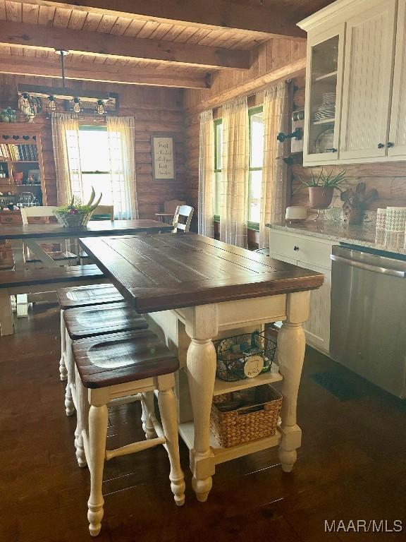 kitchen featuring wooden ceiling, glass insert cabinets, stainless steel dishwasher, open shelves, and beam ceiling