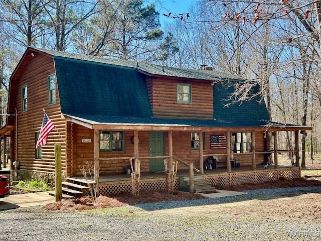 log cabin featuring roof with shingles, a porch, log exterior, and a gambrel roof