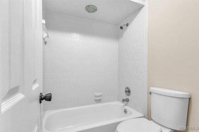 bathroom featuring toilet and shower / washtub combination