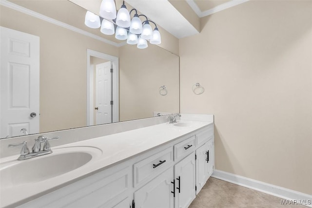 bathroom with a sink, baseboards, ornamental molding, tile patterned floors, and an inviting chandelier