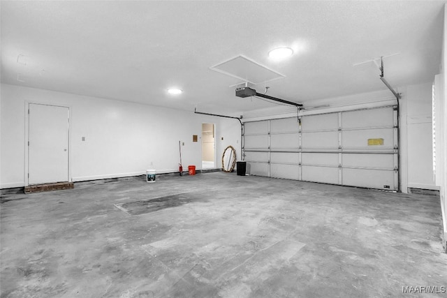 garage featuring a garage door opener