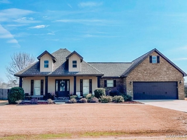 view of front of home featuring an attached garage, covered porch, a shingled roof, fence, and driveway