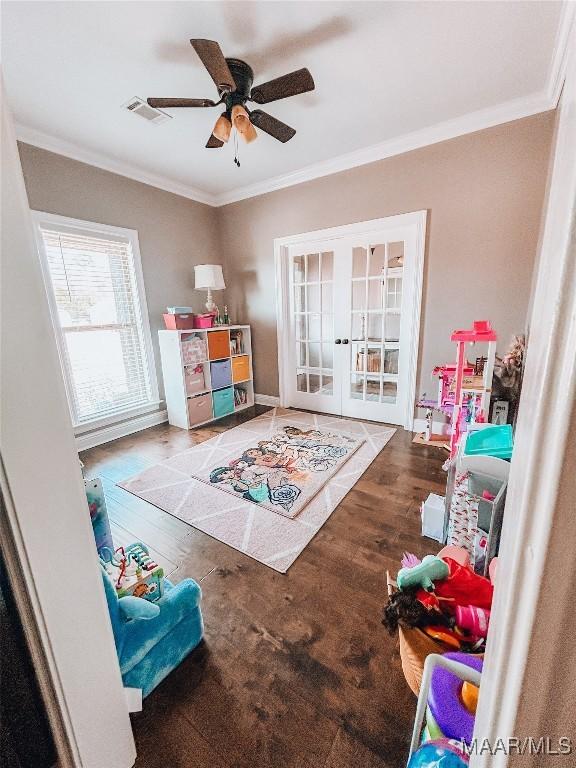 game room featuring visible vents, ornamental molding, and french doors