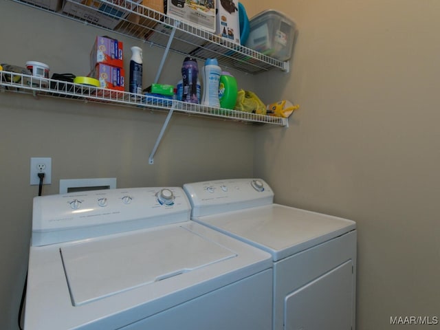 laundry room with laundry area and separate washer and dryer