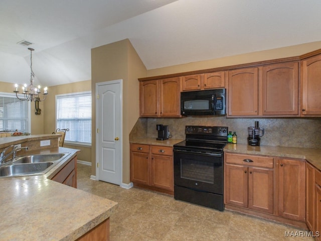 kitchen with vaulted ceiling, black appliances, brown cabinetry, and a sink