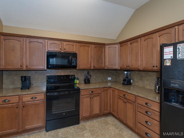 kitchen with vaulted ceiling, black appliances, brown cabinetry, and backsplash