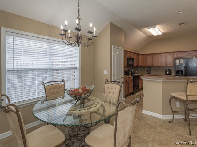 dining room with lofted ceiling, baseboards, and an inviting chandelier