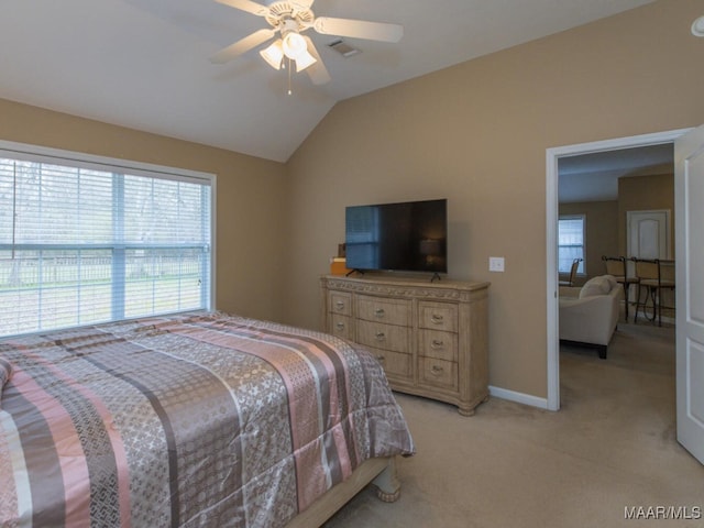 bedroom featuring lofted ceiling, ceiling fan, light colored carpet, visible vents, and baseboards