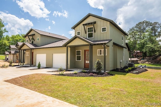 view of front of home with an attached garage, central AC, driveway, a front lawn, and board and batten siding