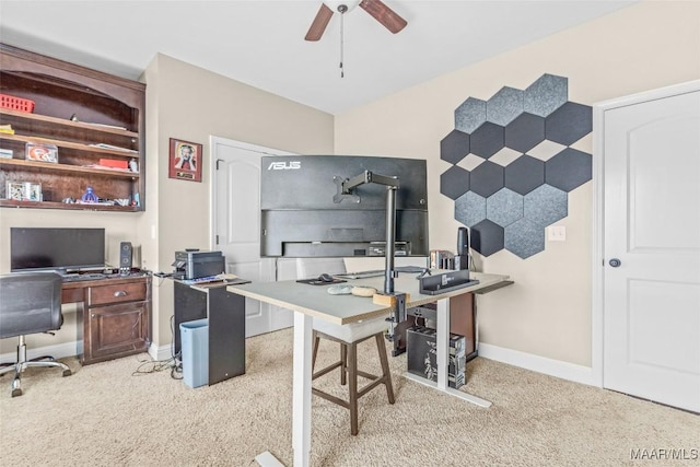 office space featuring ceiling fan, carpet, and baseboards