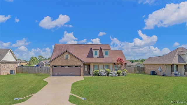 view of front of property featuring a garage, concrete driveway, fence, cooling unit, and a front lawn