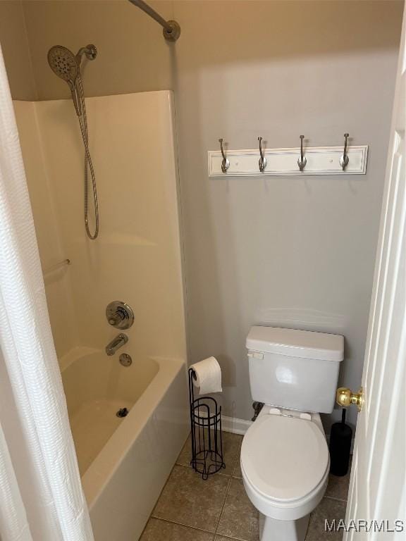 full bathroom featuring toilet, shower / tub combo, baseboards, and tile patterned floors