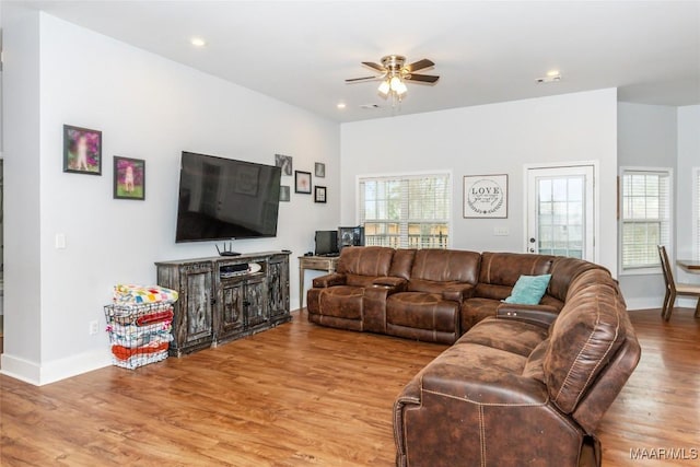 living room with a ceiling fan, light wood-type flooring, baseboards, and recessed lighting