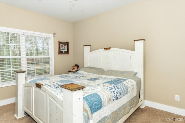bedroom featuring carpet flooring and baseboards