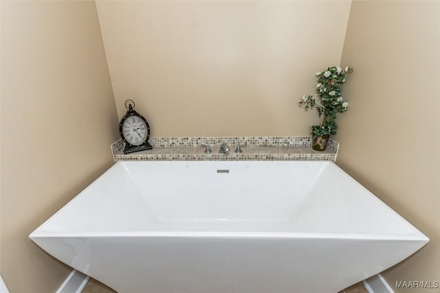 bathroom with a freestanding bath