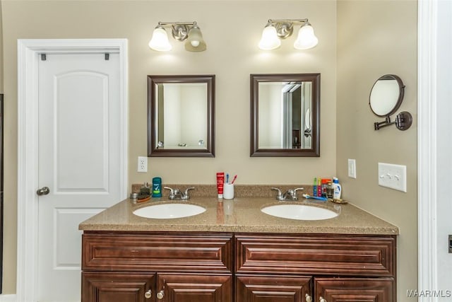 bathroom with double vanity and a sink
