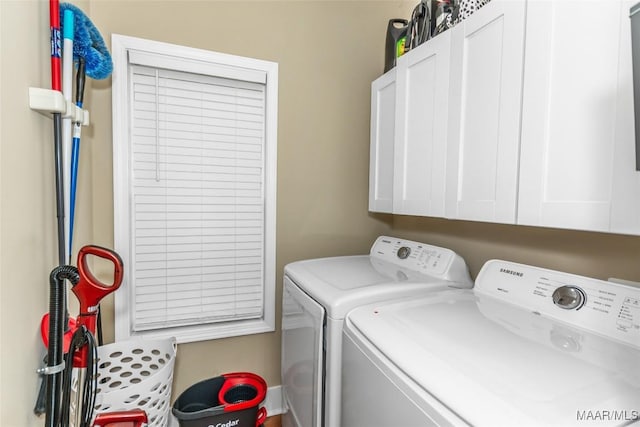 laundry room featuring cabinet space and washing machine and clothes dryer