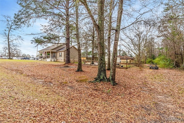 view of yard featuring covered porch
