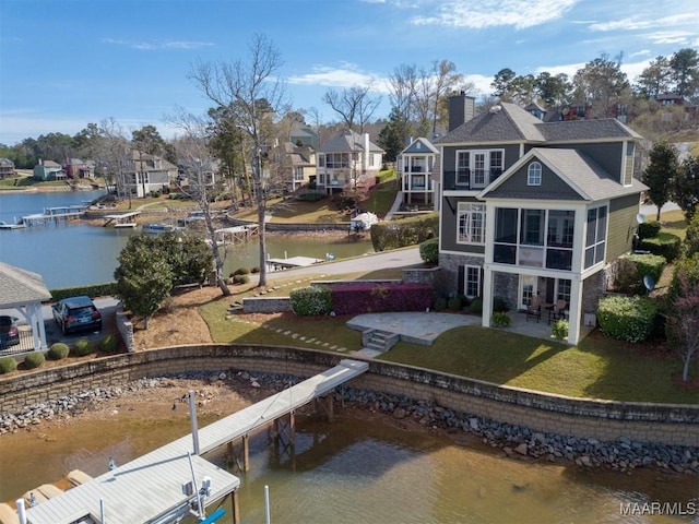 63 Point Cir, Dadeville, AL 36853 - rear view of house featuring a patio, stone siding, a residential view, a water view, and a yard