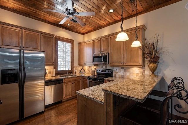 63 Point Cir, Dadeville, AL 36853 - kitchen featuring a breakfast bar area, wooden ceiling, stainless steel appliances, a peninsula, and decorative backsplash