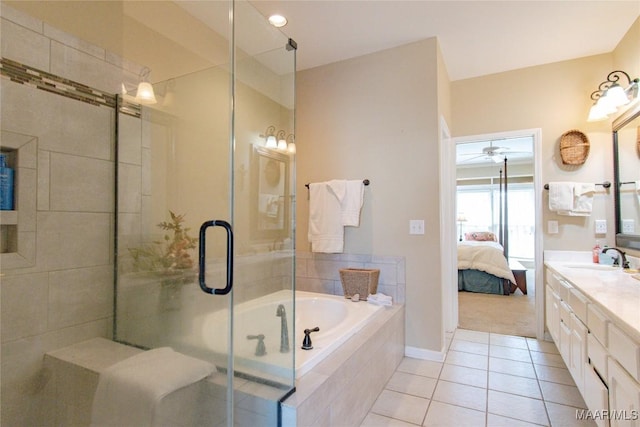 ensuite bathroom with tile patterned flooring, vanity, connected bathroom, and a shower stall