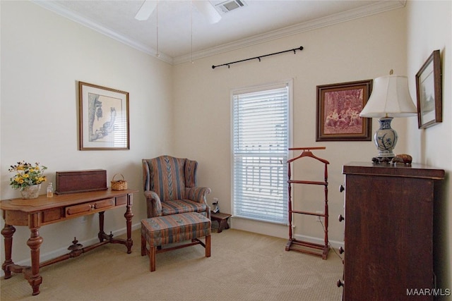 sitting room featuring carpet floors, visible vents, ornamental molding, ceiling fan, and baseboards