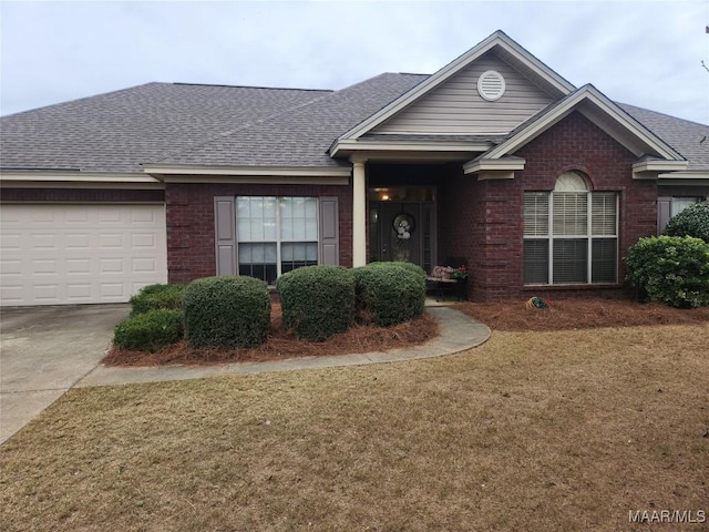 single story home with an attached garage, brick siding, a shingled roof, and a front yard