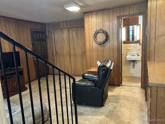 911 W Tuskeena St, Wetumpka, AL 36092 - living area featuring wooden walls and stairs