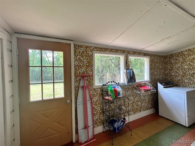 911 W Tuskeena St, Wetumpka, AL 36092 - laundry area with wallpapered walls, washer / dryer, ornamental molding, and laundry area