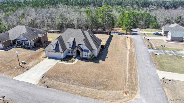 drone / aerial view with a view of trees