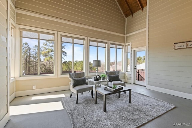 sunroom / solarium with lofted ceiling and wood ceiling