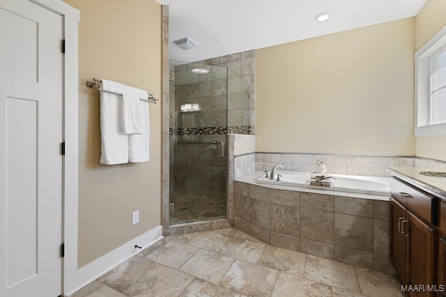 bathroom featuring visible vents, a shower stall, vanity, baseboards, and a bath