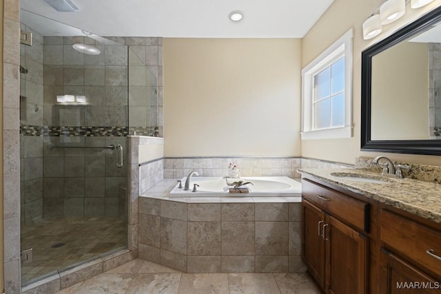 bathroom featuring visible vents, a garden tub, vanity, and a shower stall