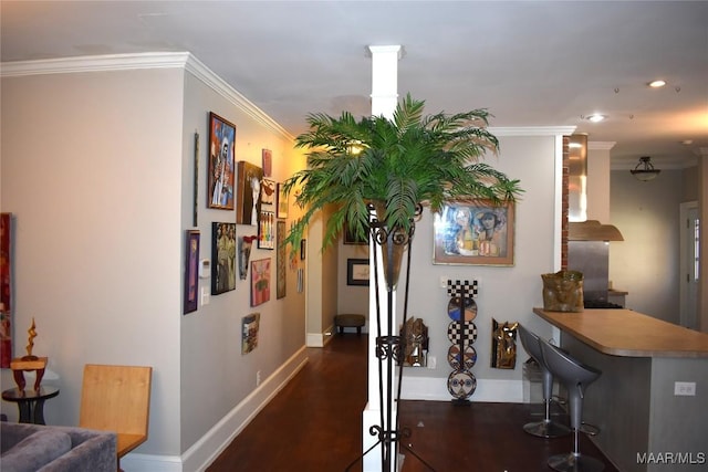 corridor featuring baseboards, dark wood-style flooring, recessed lighting, and crown molding