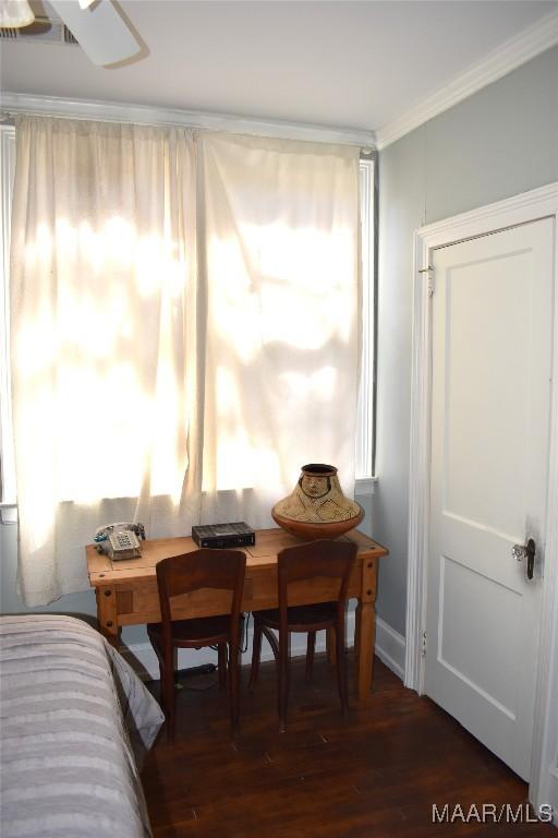 interior space featuring ornamental molding and wood finished floors