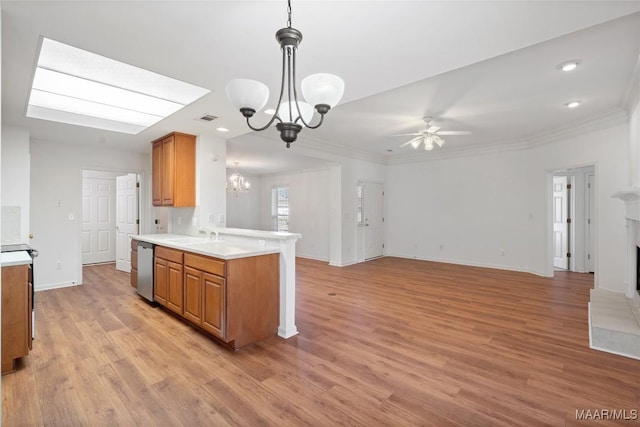 kitchen featuring light countertops, brown cabinets, visible vents, and stainless steel dishwasher